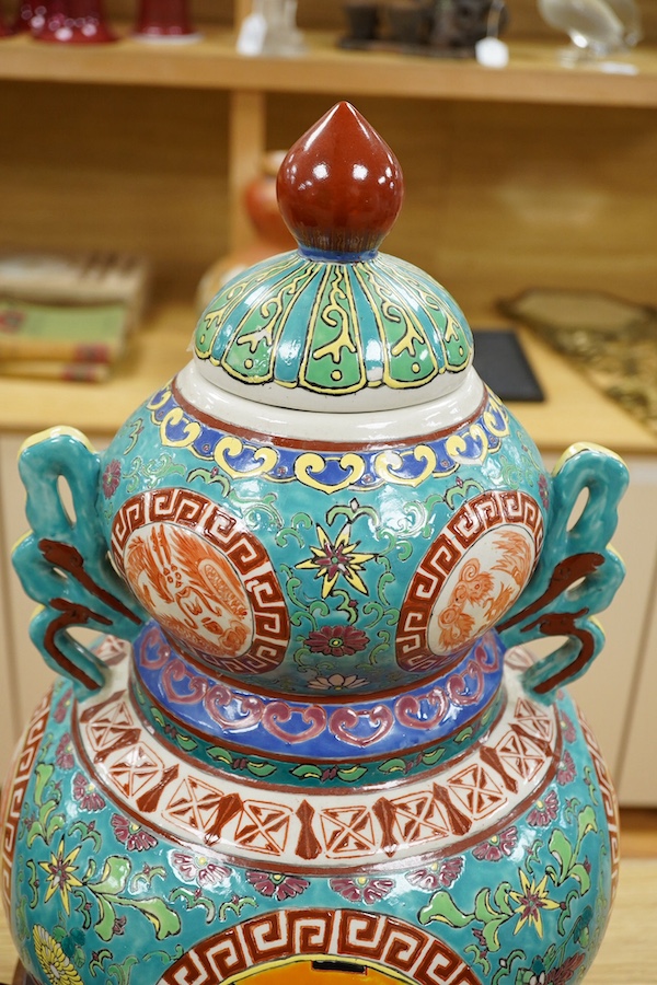 A Chinese double-gourd vase and cover, on associated hardwood stand, total height 65cm. Condition - fair to good